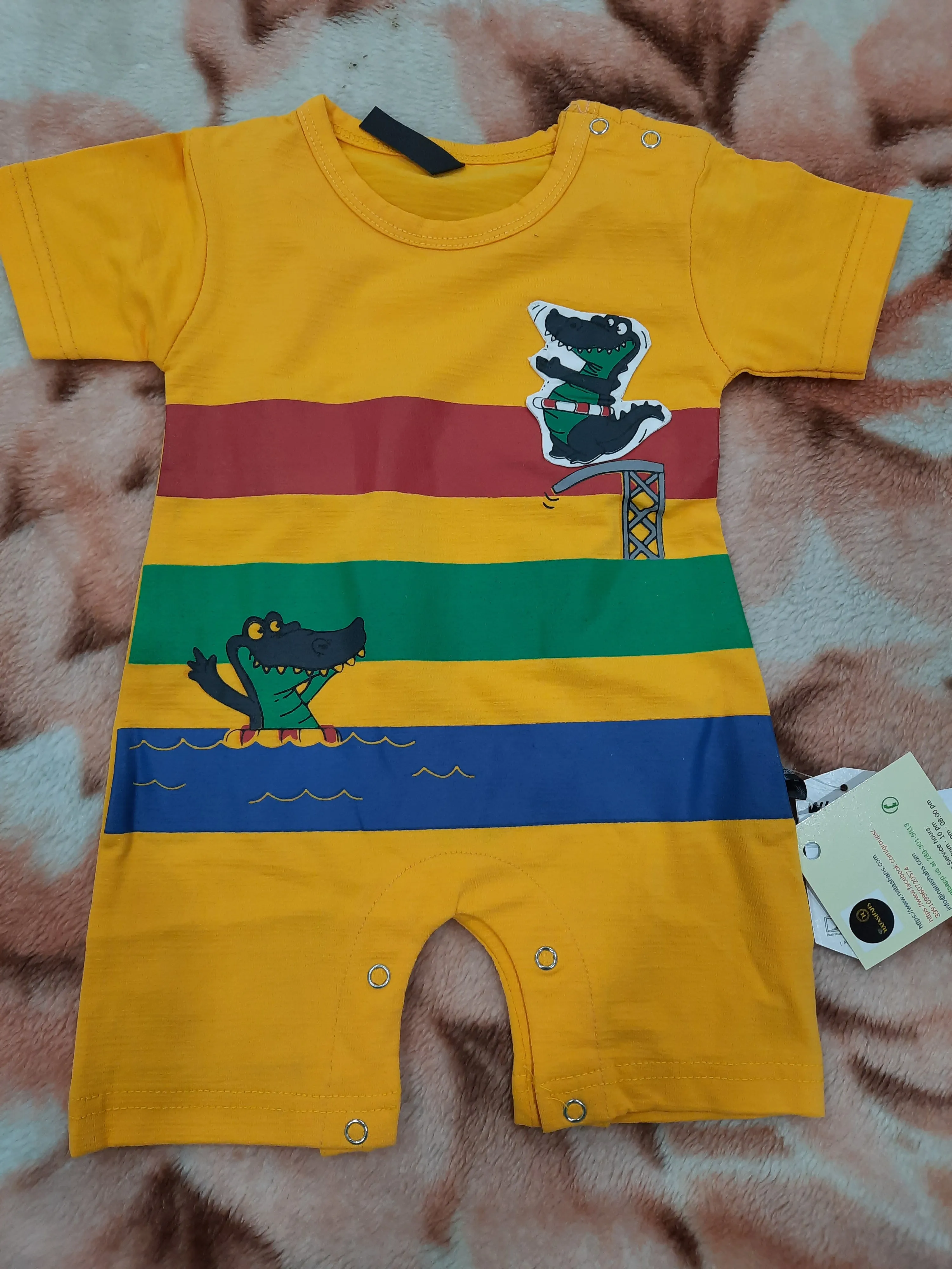 Baby romper in yellow color printed